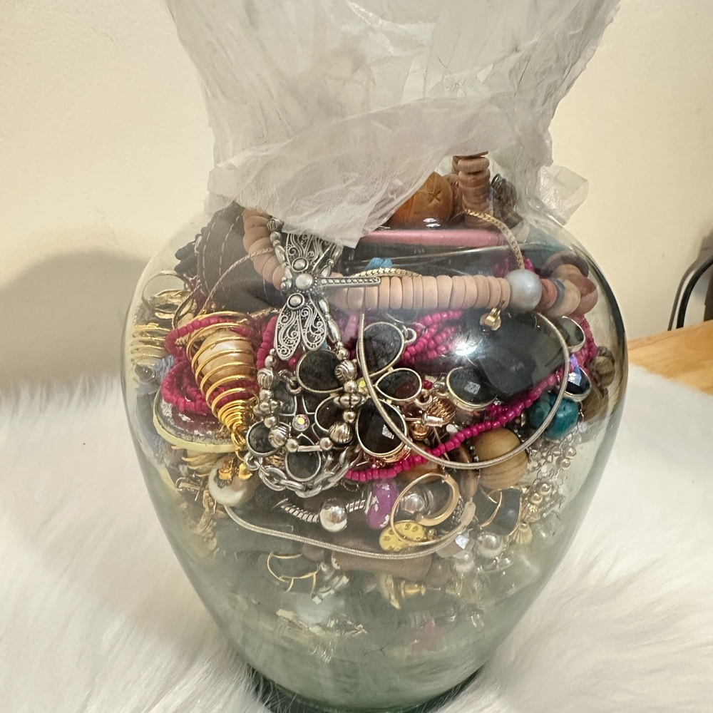 Assorted Jewelry in Glass Vase